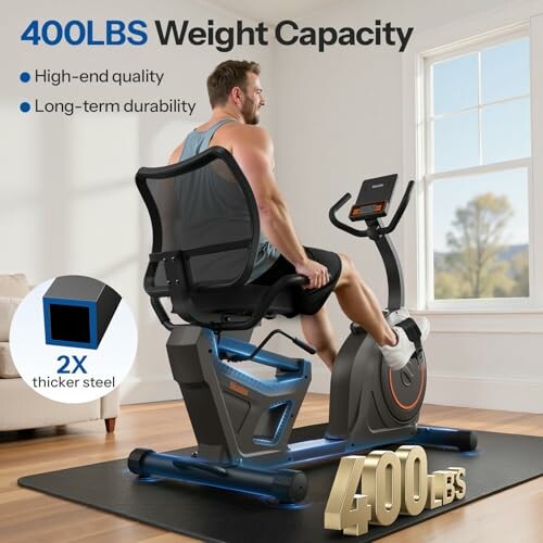 Man using recumbent exercise bike with 400 lbs weight capacity.