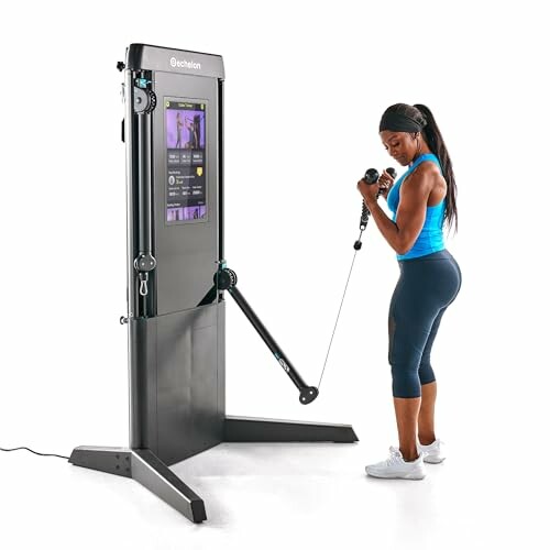 Woman using a home fitness machine with digital screen