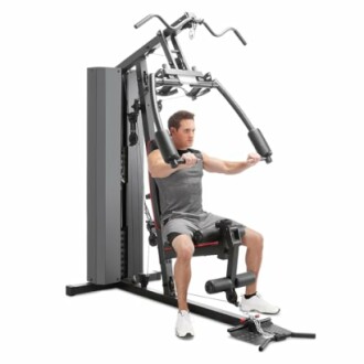 Man using a home gym exercise machine for strength training.