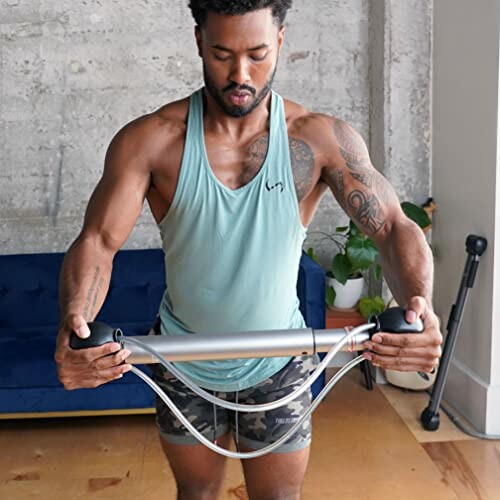 Man using resistance bar for exercise at home
