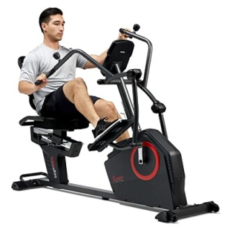 Man using a recumbent exercise bike with moving handlebars.