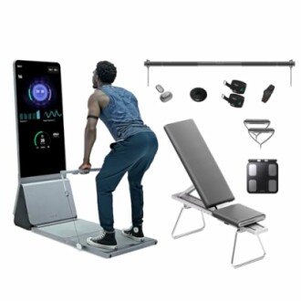 Man using smart home gym equipment with bench and accessories.
